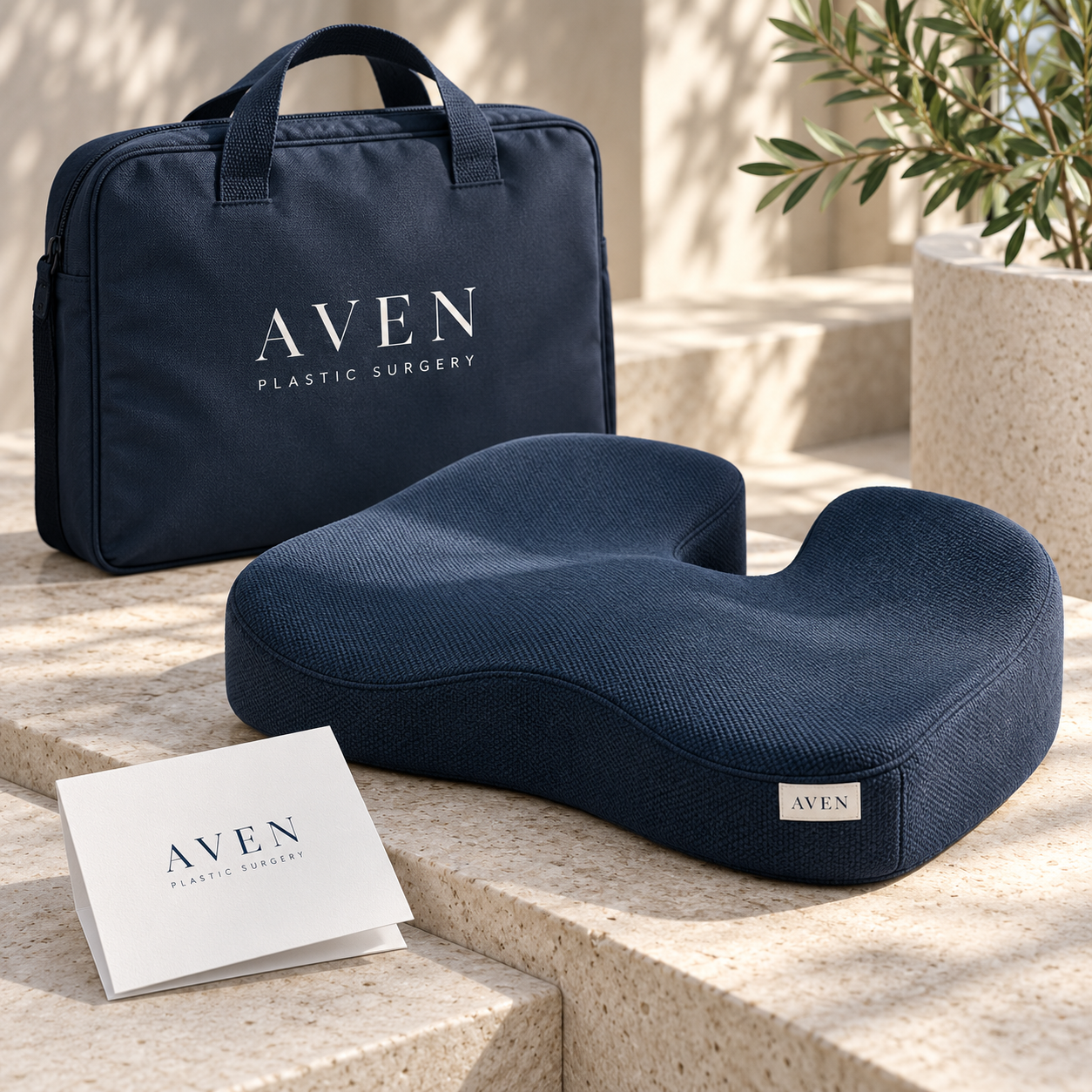 Navy AVEN branded recovery seat cushion with a matching carry bag and care-information card